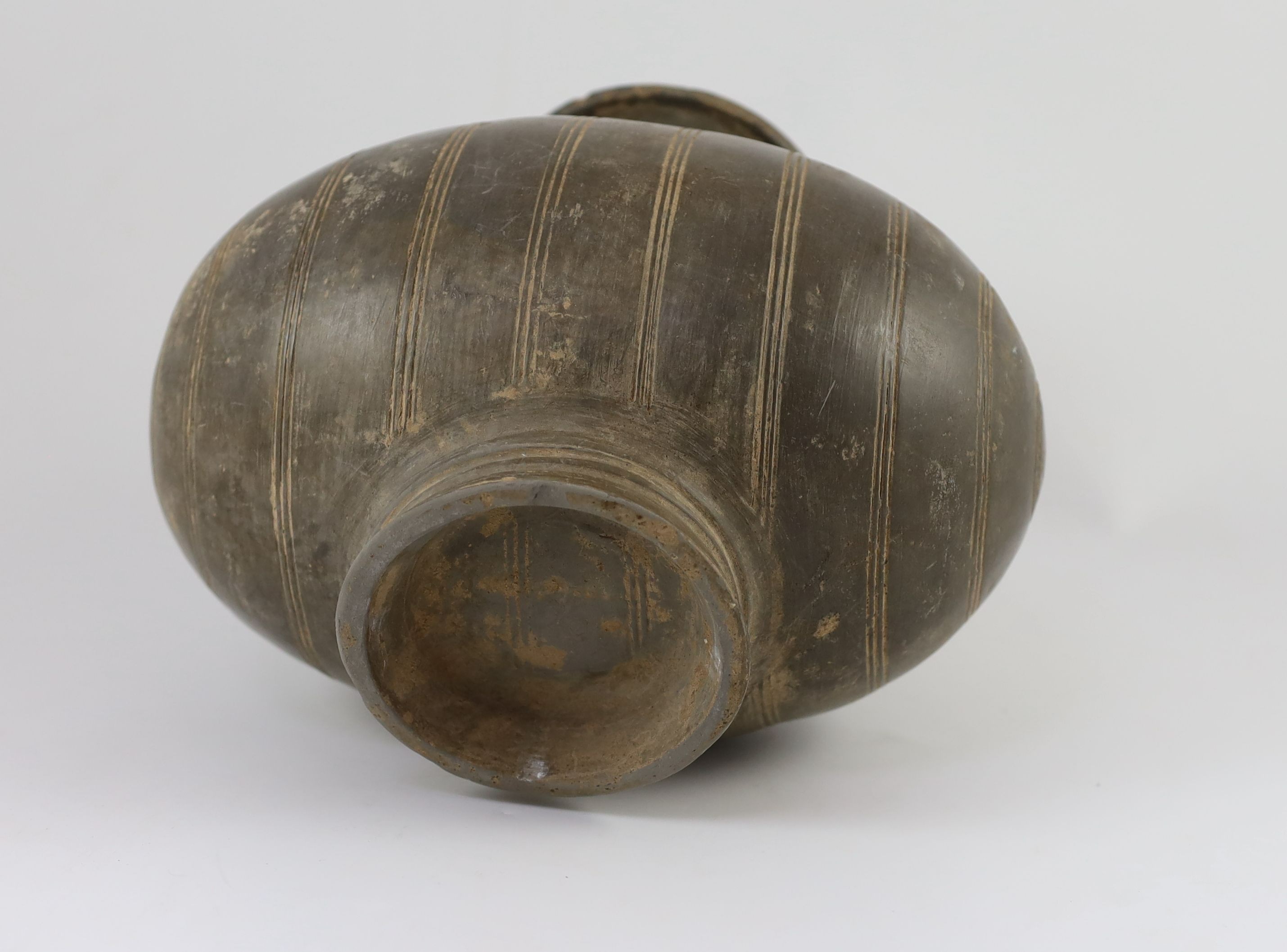 A Chinese black pottery cocoon-shaped jar, Western Han dynasty, (206 B.C.–A.D. 9) 25cm high